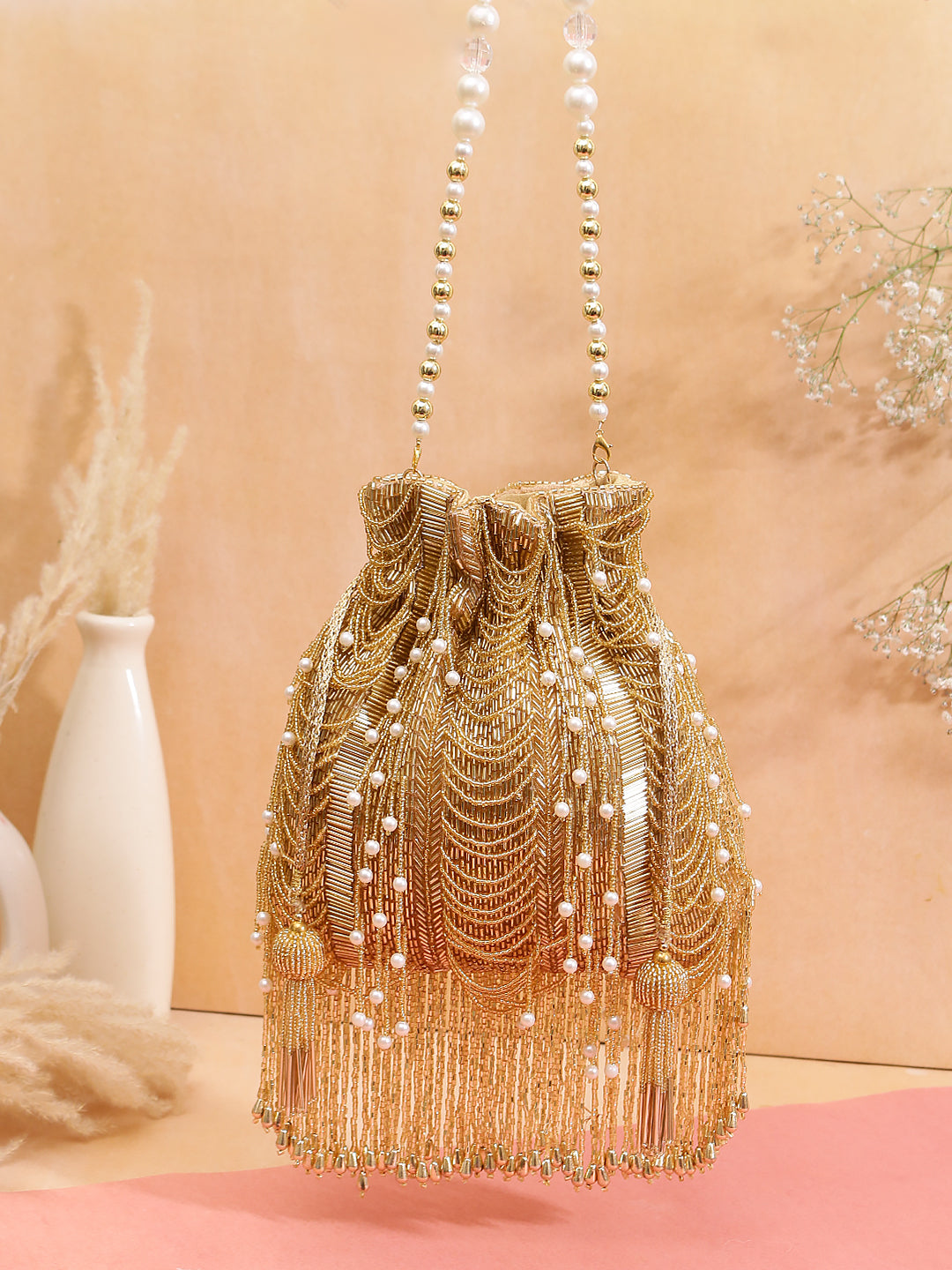 Designer Heavy tassel Potli golden work